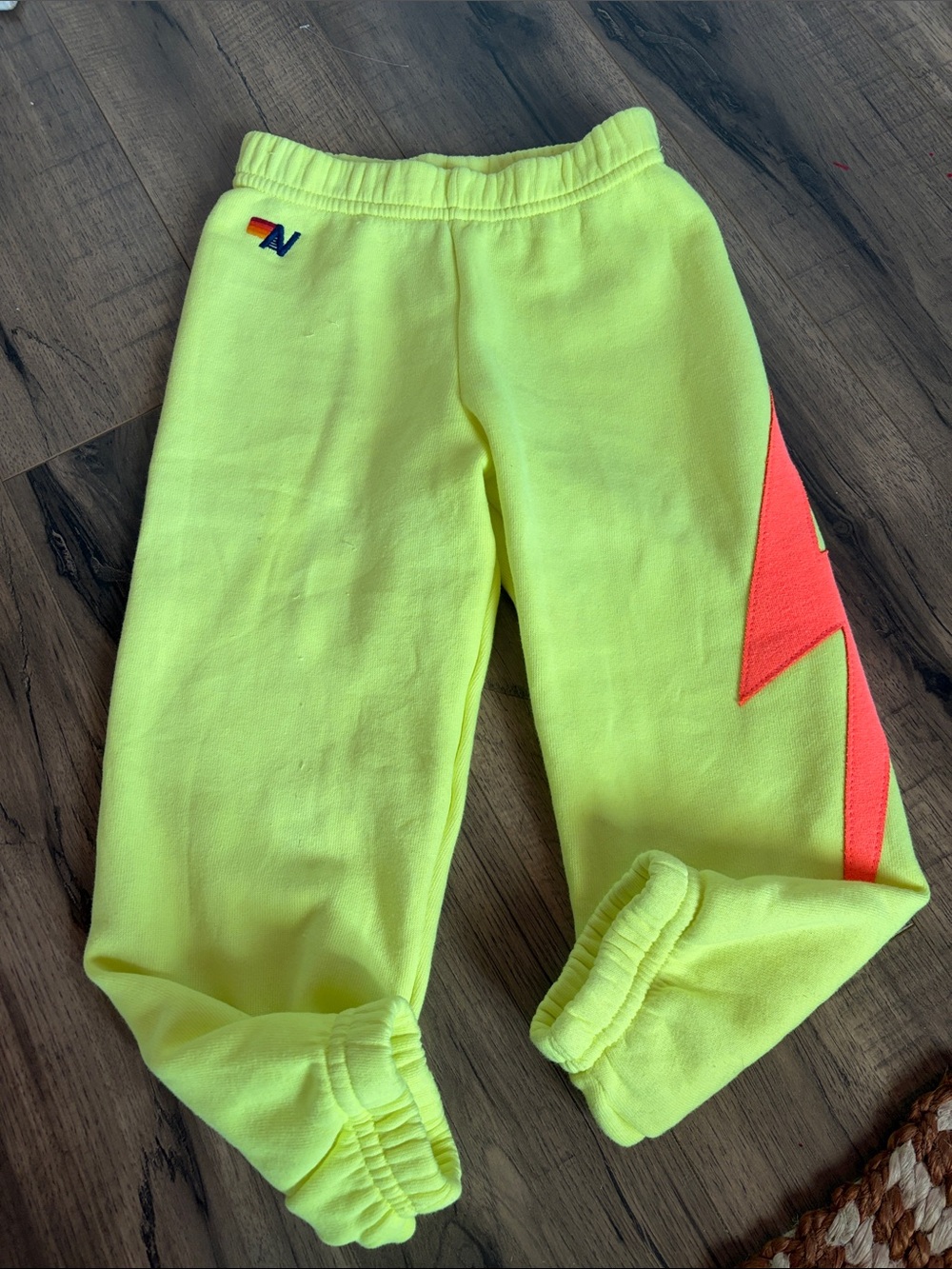 Aviator nation Kids bright Yellow Fleece Joggers with orange lightning bolt